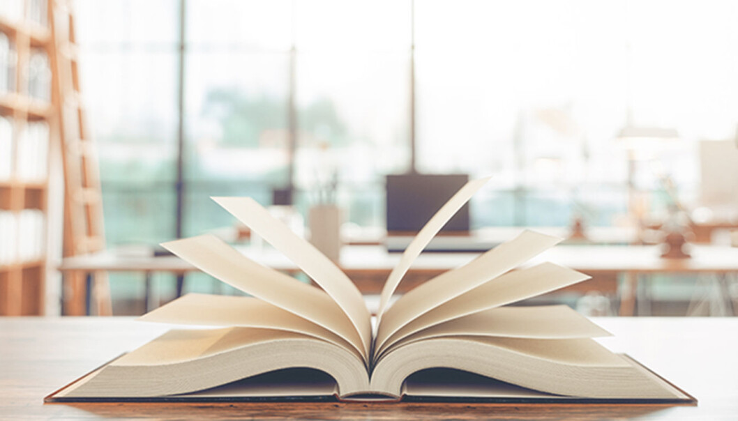 Old books on the desk in a library. Old books on the desk in a library.
